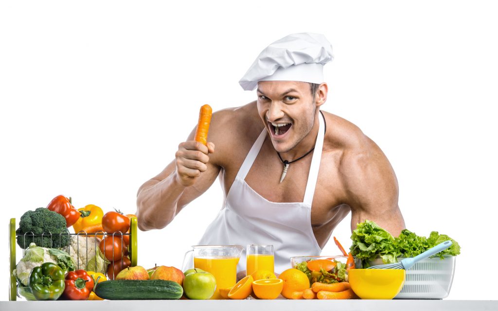 Man bodybuilder eating more fruits and vegetables to lose weight