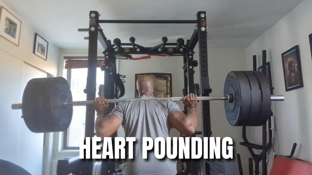 Author performing squats showing the cardiovascular effects of high intensity training